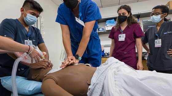 Students working in a simulation center