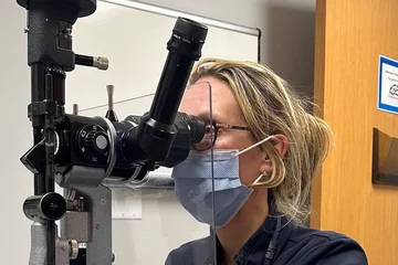 Ophthalmologist Dr. Jo Ann Giaconi using lab equipment 