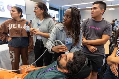 Medical students using equipment in POCUS intro course