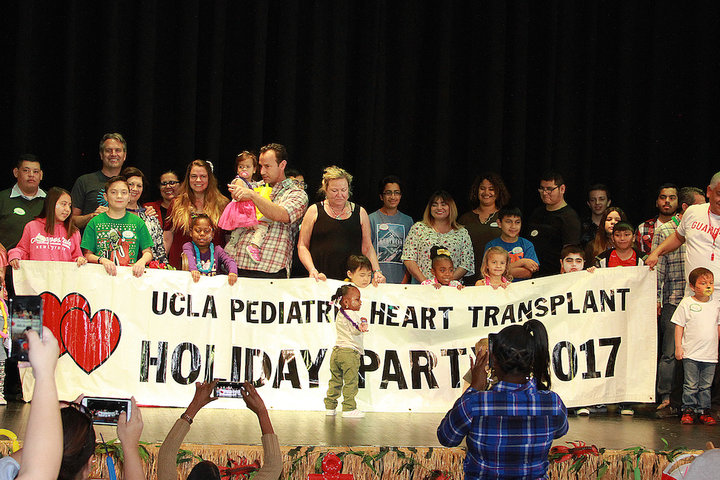 A team of pediatric cardiology physicians hosting a party for pediatric transplant patients 