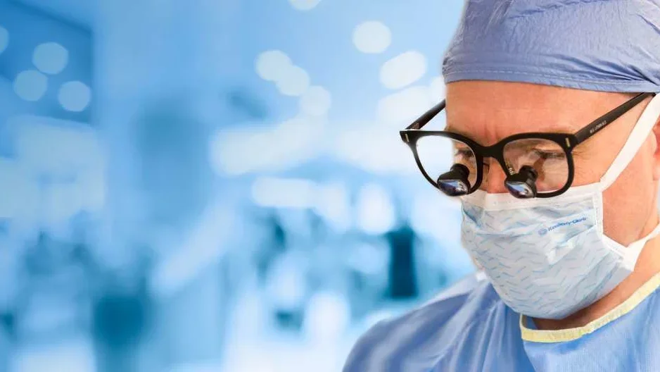 Close up of doctor in scrubs and glasses 