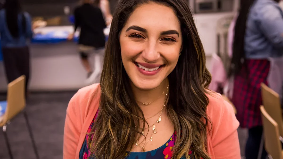 Medical student Pre Med student Eviola Nakhla smiles for the camera at a student wellness event
