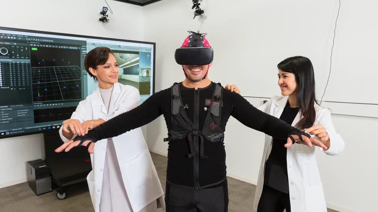 Investigators researching virtual reality technology with a human subject