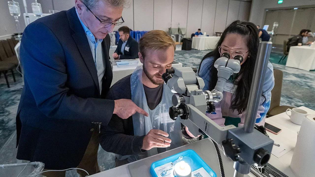 Two students and one faculty learning cataract surgery essentials