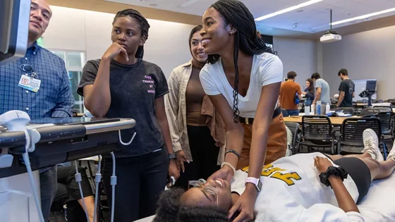 Students try techniques during POCUS week in the learning studio
