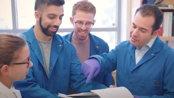 A scientific team in medical school reviewing documents together
