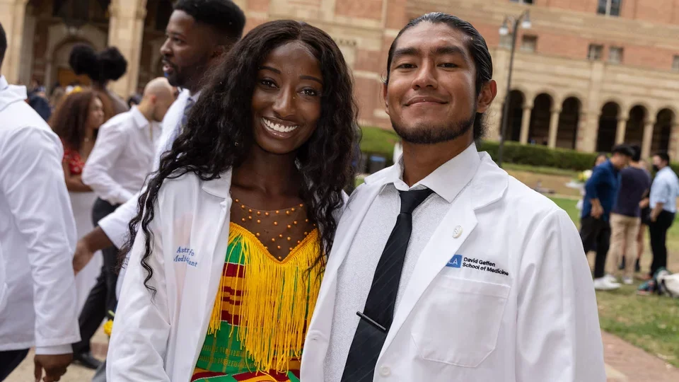 Becoming a doctor story: Faustino Gonzalez Barrales and a friend during their White Coat Ceremony