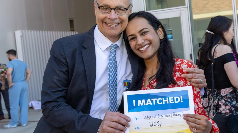 Dr. Lee Miller, associate dean of student affairs, congratulates medical school student, Aloukika Shah, on her internal medicine match to UCSF.