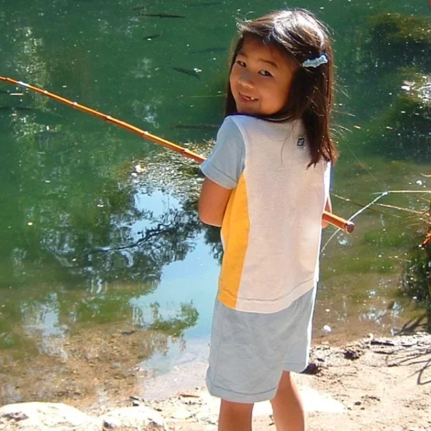 UCLA PhD student Nikki Cheung, pictured here fishing as a young child. 