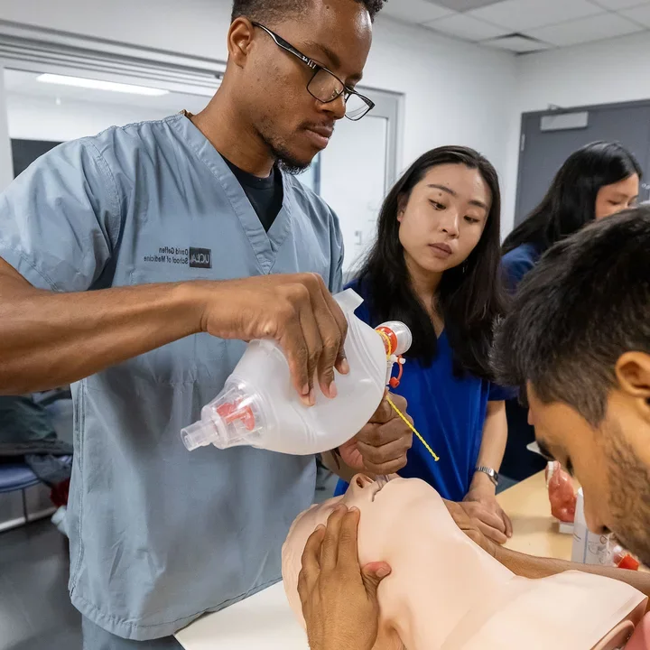 Medical student Laz Curry completing a clinical training exercise with his classmates. 