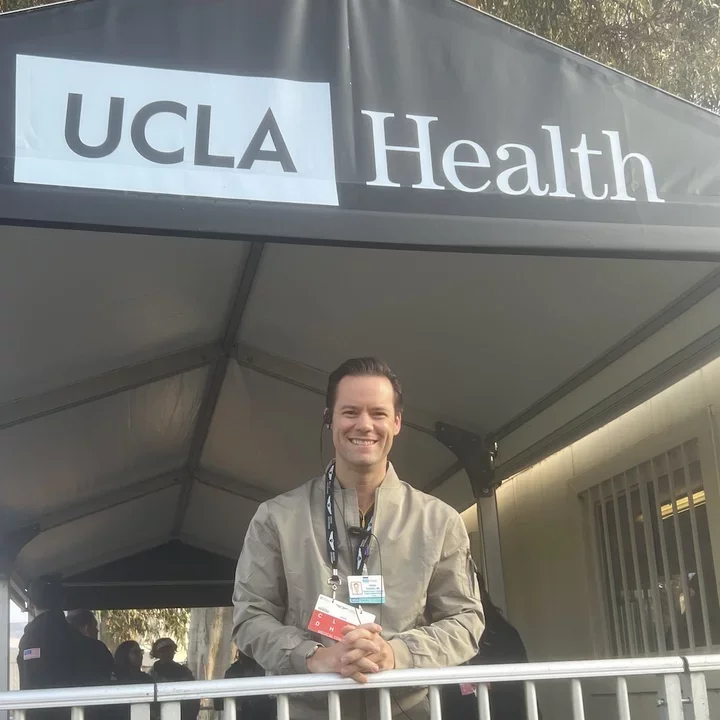 UCLA Surgical Oncologist Dr. Brian Kadera, pictured standing under UCLA Health signage