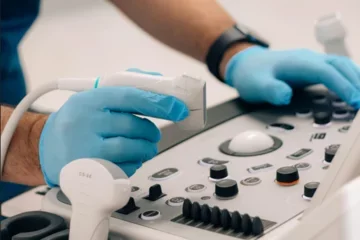 Doctor holding ultrasound tool