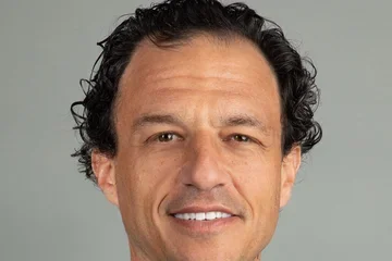 smiling physician wearing suit