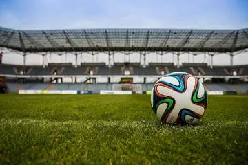 soccer ball on a field in a stadium 