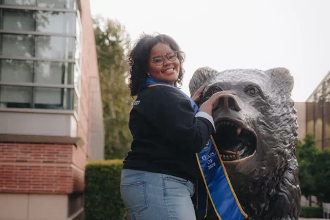 Becoming a doctor: Ky'Tavia Stafford-Carreker with UCLA Bruin bear