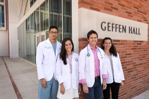 First cohort of the David Geffen Medical Scholarship pose in front of Geffen Hall