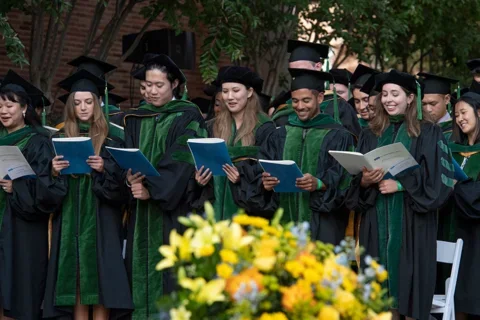 Medical School vs. Law School Graduating medical students read the hippocratic oath in unison