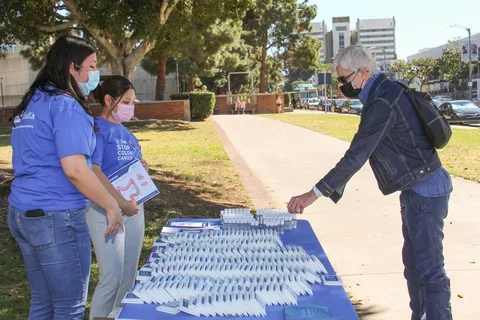 How to Prevent Cancer Via Lifestyle Choices. Person getting info on colon cancer screenings