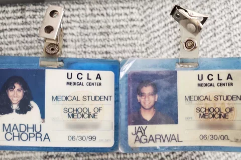 Medical school identification badges for two alumni from 1998