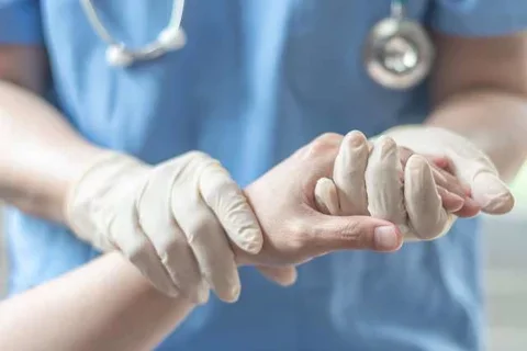 What Does An Anesthesiologist Do Doctor Holding Patient Hand