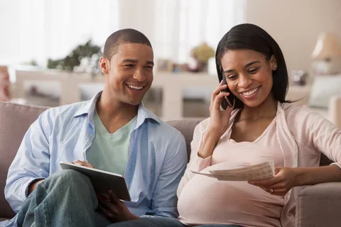 Pregnant couple smiling