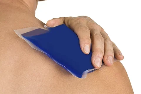 male holding shoulder from pain