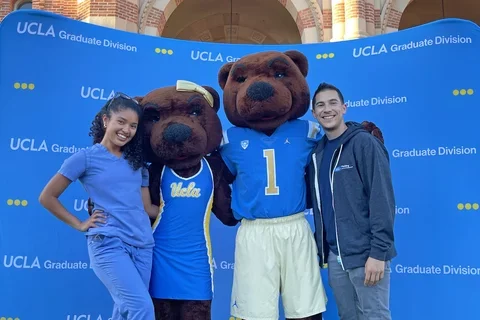Rigoberto Perez Hernandez, pictured here with fellow UCLA resident and the Bruin mascots, shares his story of becoming a doctor 