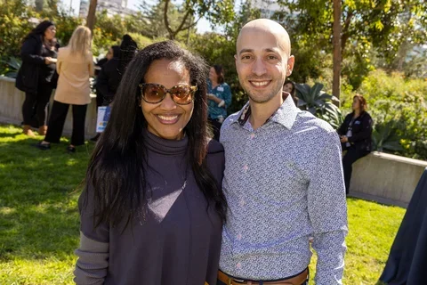 Two coworkers smiling