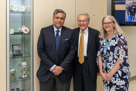 Drs. Kalyanam Shivkumar, Michael Fishbein and Sarah Dry stand in front of the newly dedicated Michael C. Fishbein, MD Heart Collection. 