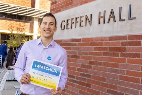 Medical student Rigoberto Perez Hernandez pictured with his residency match results