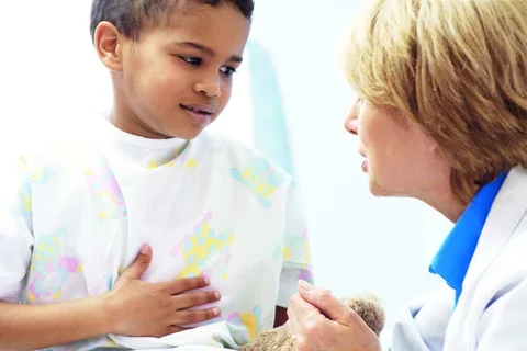 A pediatrician with a young patient.
