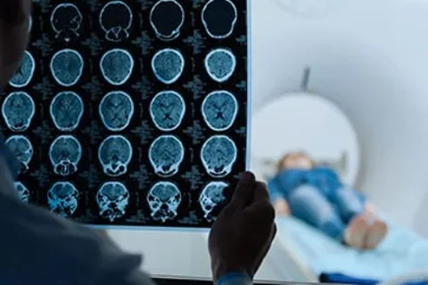 Neurologist and a patient during an imaging scan 