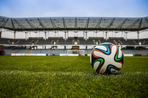 soccer ball on a field in a stadium 