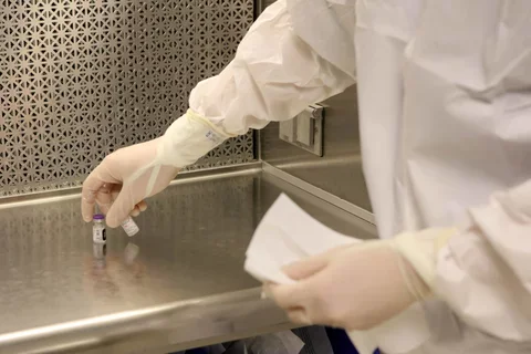 scientist holding needle