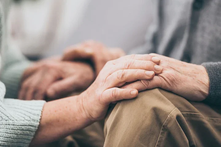 Lewy Body Dementia (LBD) Caregiver Support Group Elderly Person Being Comforted