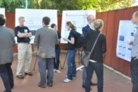 Group of people outdoors in front of PhD in Human Genetics presentation boards