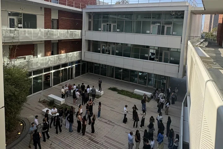 A group of new medical students gather for Basecamp in the Geffen Hall courtyard