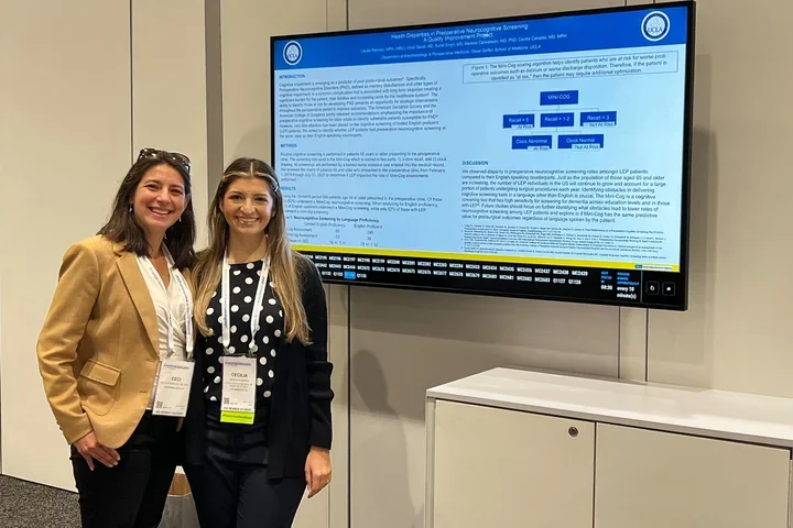 Dr. Canales with a mentee at a presentation