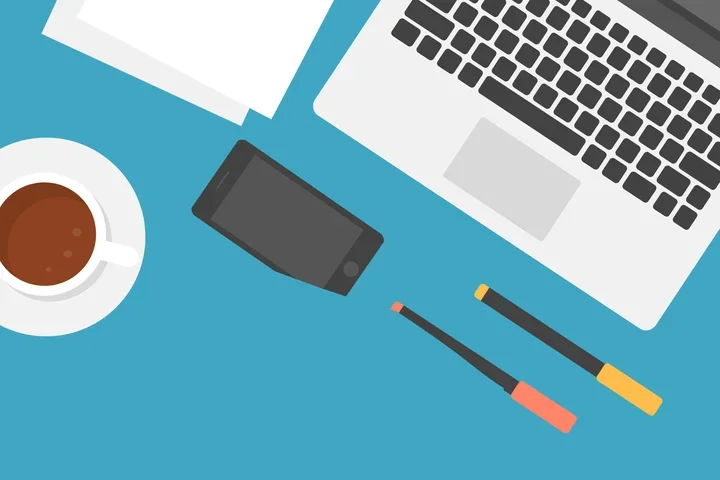 2D image of overhead view of a laptop, papers, phone, pencils, and coffee