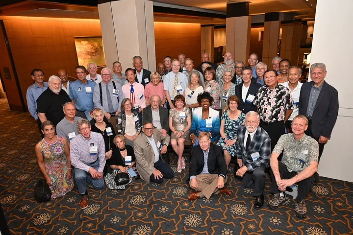 Attending alumni from the Class of 1976 come together for a group photo in celebration of their 50th reunion. 