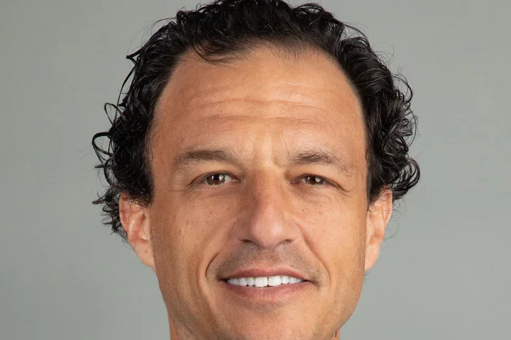 smiling physician wearing suit