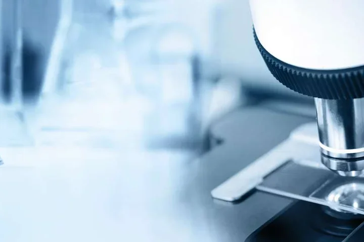 Close up of powerful microscope looking at slide sample 