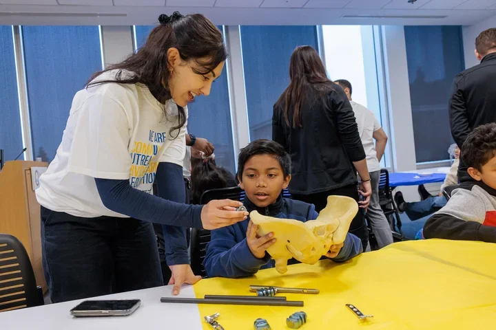 Medical student helping youth