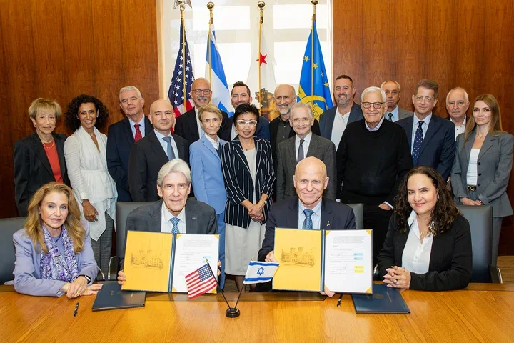 UCLA Chancellor Julio Frenk and The Hebrew University of Jerusalem President Tamir Sheafer at MOU signing ceremony, joined by David Geffen School of Medicine leaders and other university representatives and supporters