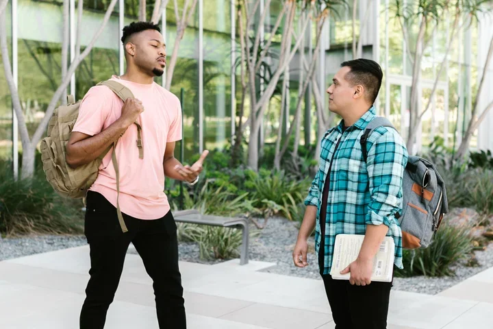 2 students speaking 