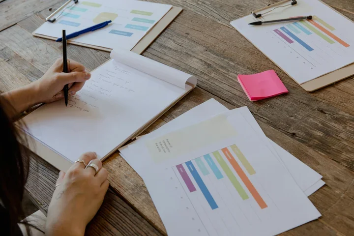 Meeting notes and graphs on table