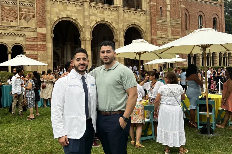 Becoming a Doctor: Gustavo Castellanos and his brother at the White Coat Ceremony