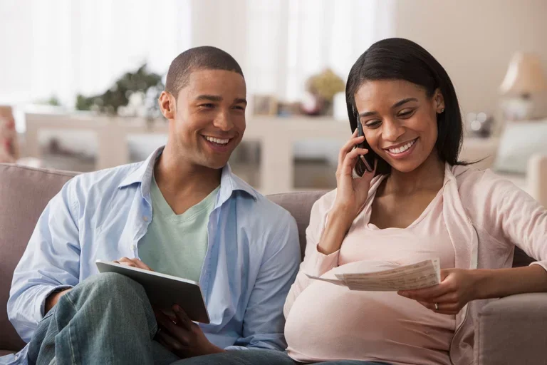 Pregnant couple smiling