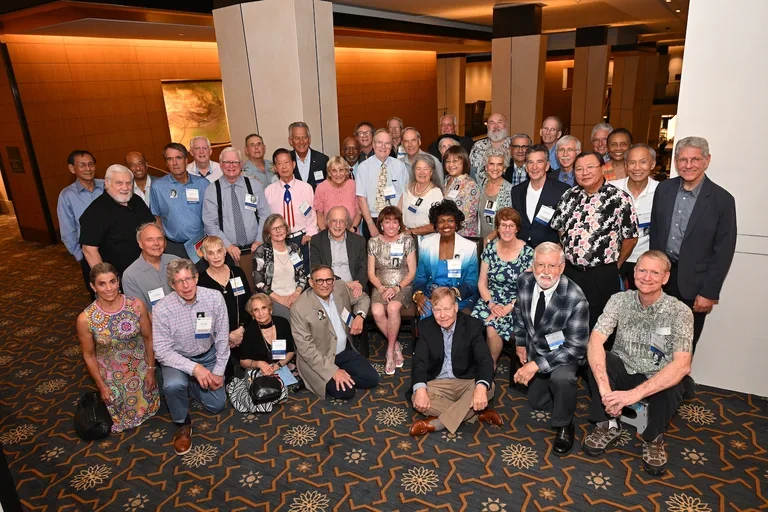 Attending alumni from the Class of 1976 come together for a group photo in celebration of their 50th reunion. 
