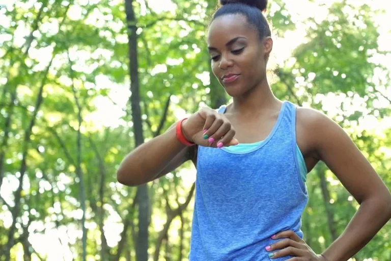 woman using fitness tracker